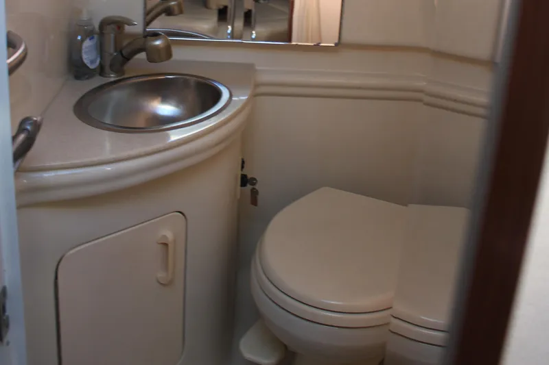 Slide: The Image of Compact bathroom in 2008 Sea Ray Sundancer yacht with sink and toilet. - 8