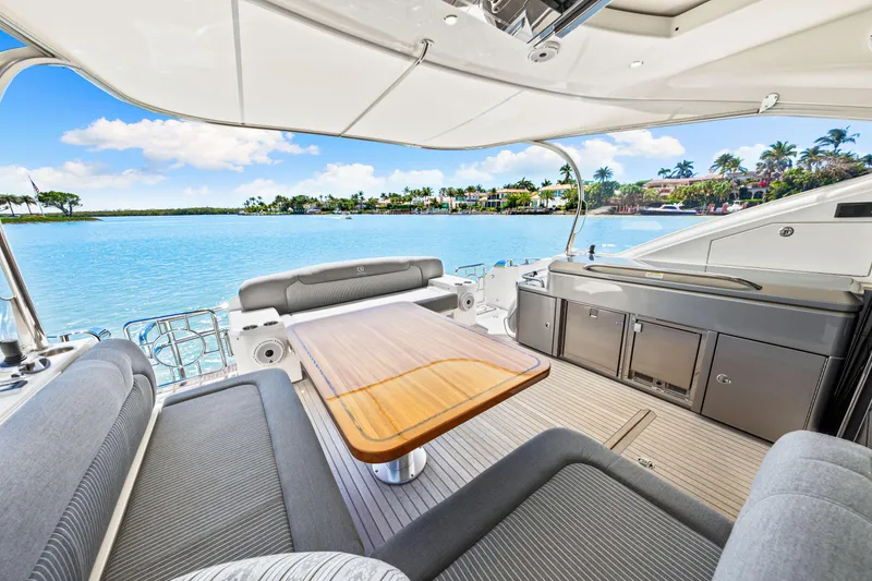 Slide: The Image of 2022 Riviera 5400 Sport Yacht interior with scenic waterfront view. - 44