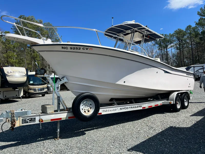 Slide: The Image of 2003 Grady-White Chase 273 boat on trailer, parked outdoors under clear sky. - 1