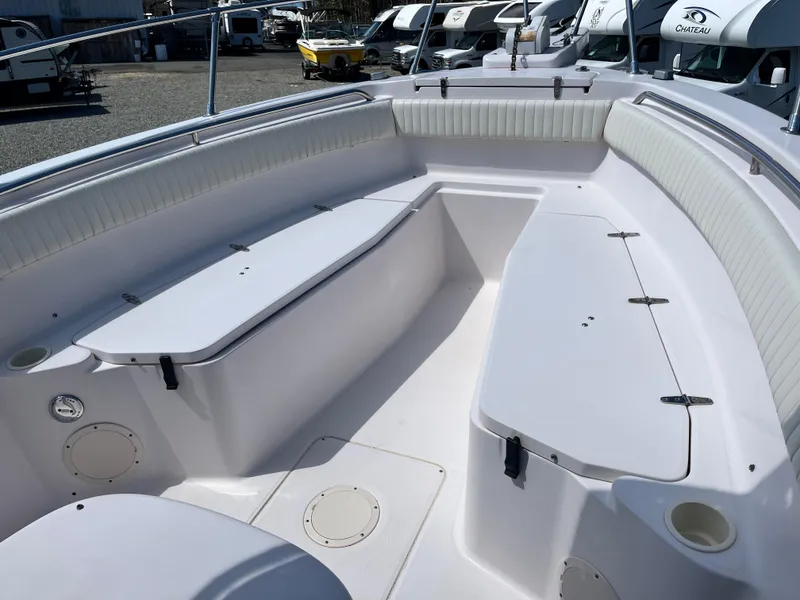 Slide: The Image of 2003 Grady-White Chase 273 boat interior with spacious seating and storage compartments. - 10