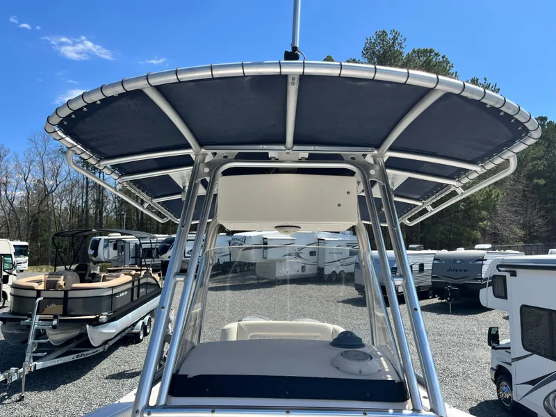 Slide: The Image of 2003 Grady-White Chase 273 boat with T-top, parked among RVs and trailers. - 15