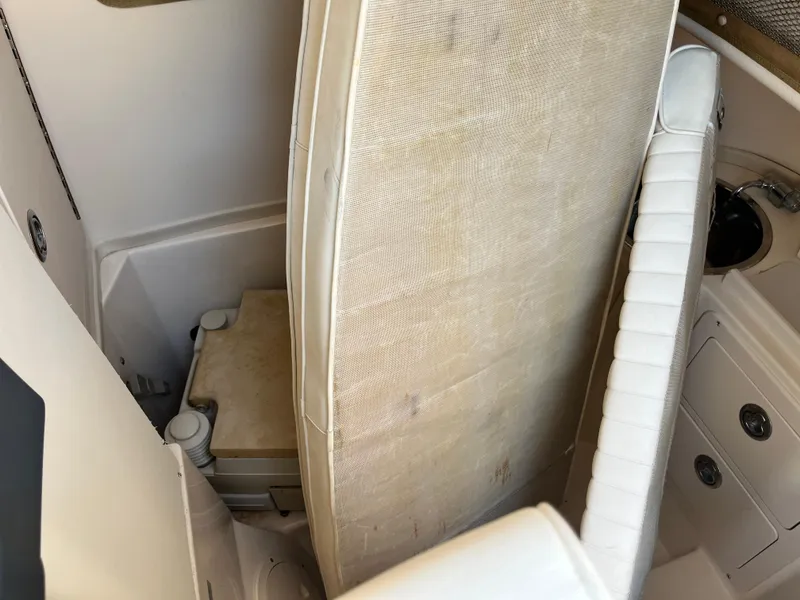 Slide: The Image of 2003 Grady-White Chase 273 boat interior with seating and storage area. - 18