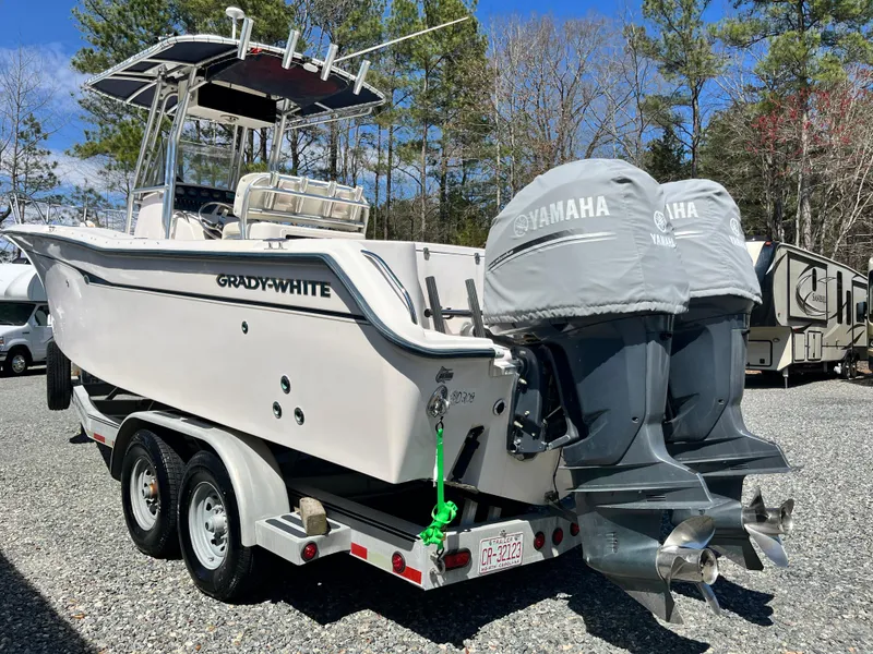 Slide: The Image of 2003 Grady-White Chase 273 boat on trailer with twin Yamaha engines. - 2