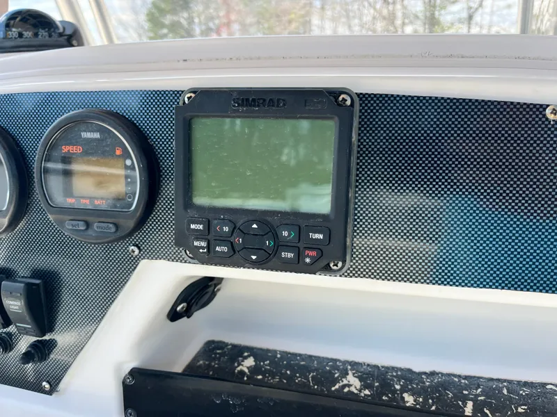 Slide: The Image of Dashboard of 2003 Grady-White Chase 273 with Simrad display and Yamaha speedometer. - 22
