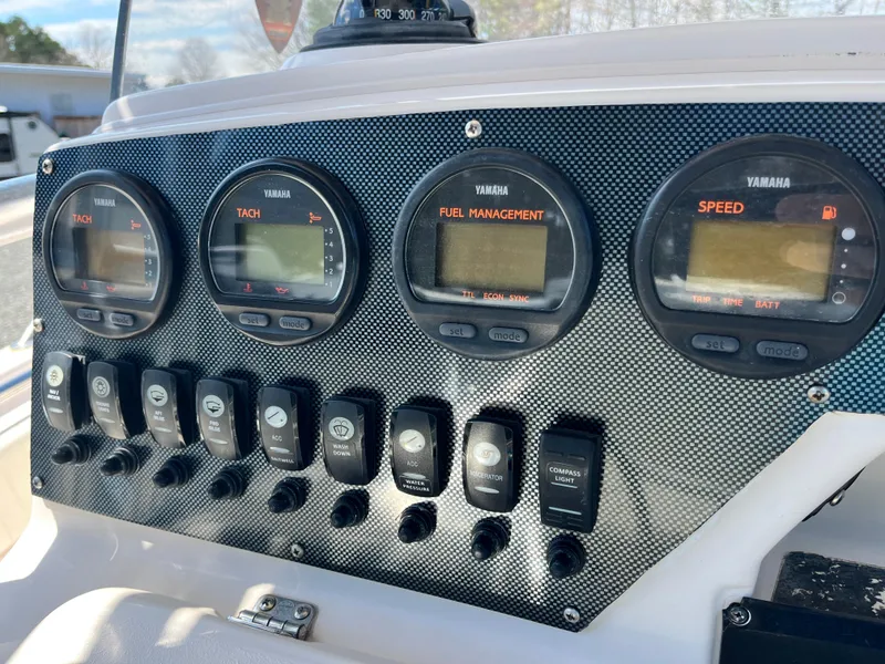 Slide: The Image of Dashboard of 2003 Grady-White Chase 273 boat with Yamaha gauges and switches. - 23