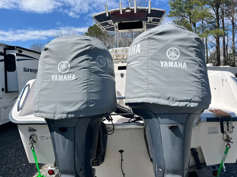 Slide: The Image of 2003 Grady-White Chase 273 boat with Yamaha engine covers, parked outdoors. - 7