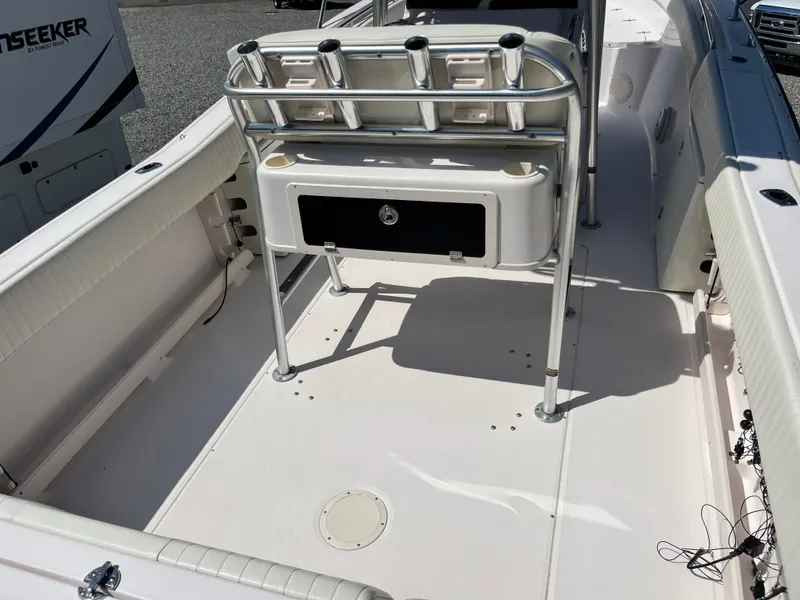 Slide: The Image of 2003 Grady-White Chase 273 boat deck with rod holders and storage compartment. - 9