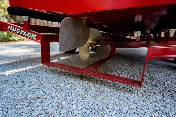 Slide: The Image of Propeller of 1941 Hacker-Craft Deluxe boat on gravel surface. - 23