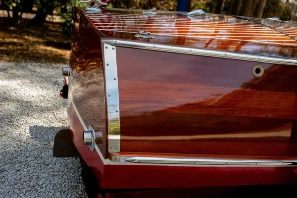 Slide: The Image of 1941 Hacker-Craft Deluxe boat with polished wooden finish and chrome details. - 40