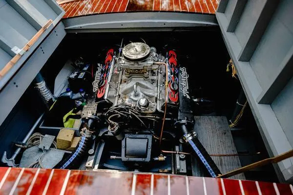 Slide: The Image of 1941 Hacker-Craft Deluxe engine compartment with detailed mechanical components. - 48