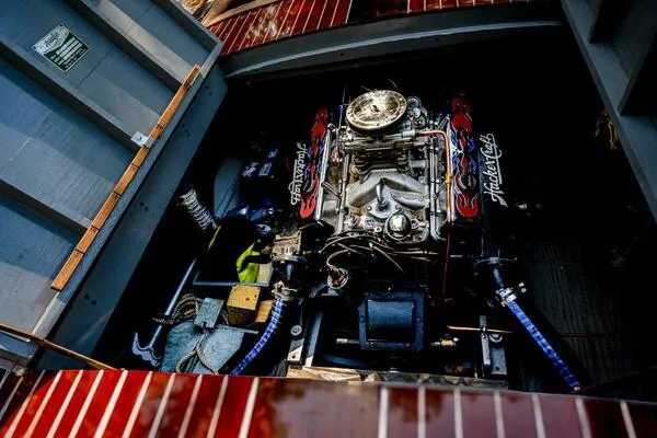 Slide: The Image of 1941 Hacker-Craft Deluxe engine with chrome details and wooden deck. - 9