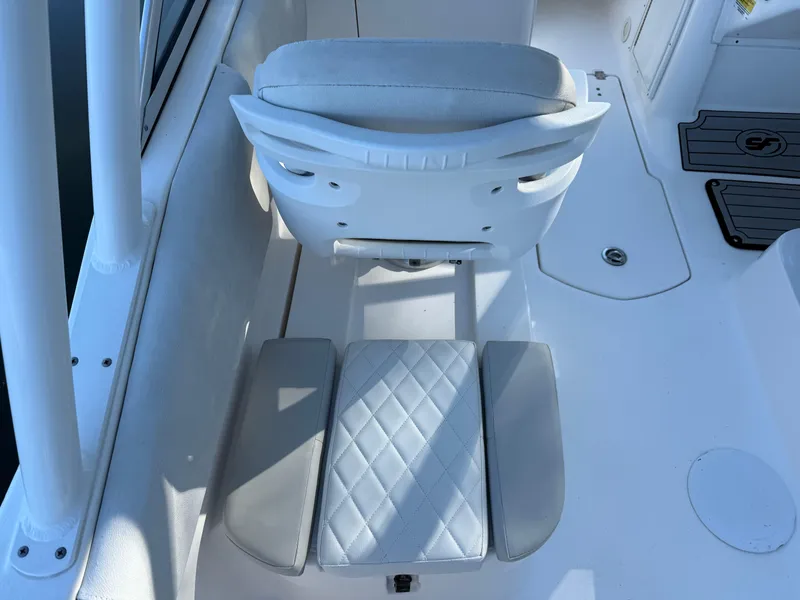 Slide: The Image of 2020 Sea Fox 226 Traveler boat seat with white cushioned upholstery and diamond stitching. - 10