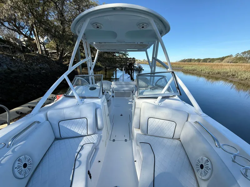 Slide: The Image of 2020 Sea Fox 226 Traveler boat interior with seating, on a calm river. - 13