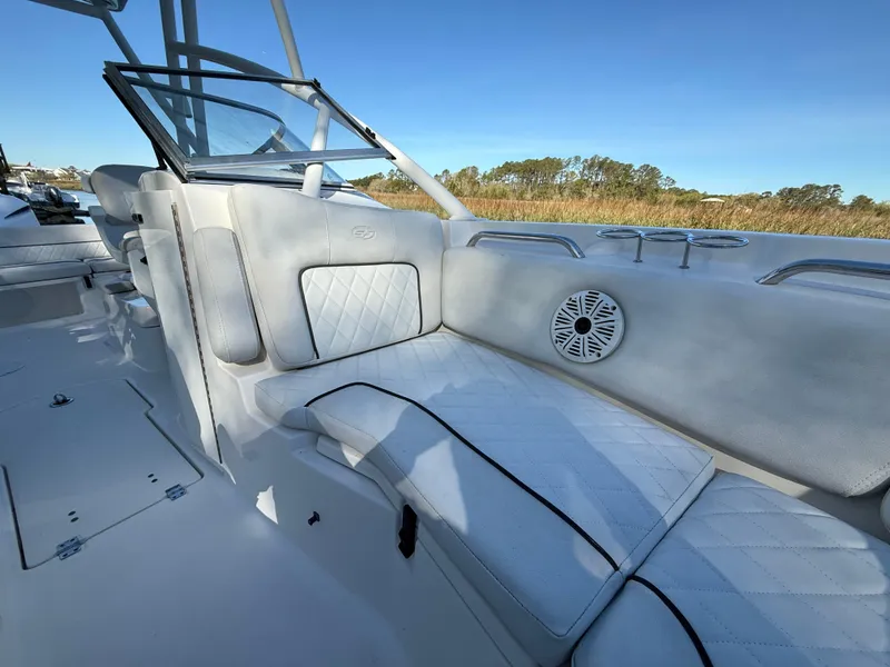Slide: The Image of 2020 Sea Fox 226 Traveler boat interior with cushioned seating and speaker. - 14