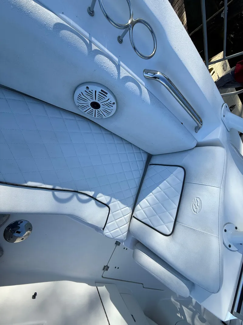 Slide: The Image of 2020 Sea Fox 226 Traveler boat interior with white cushioned seating and speaker. - 15