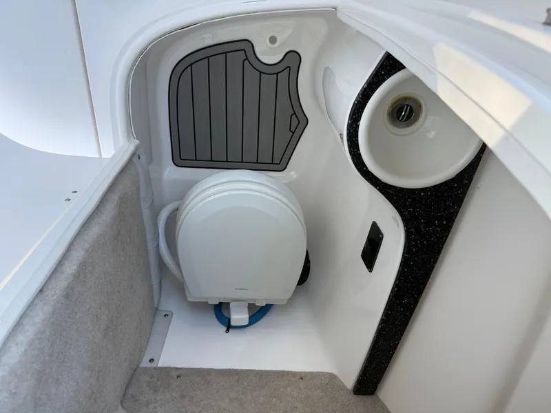 Slide: The Image of Interior of 2020 Sea Fox 226 Traveler boat, featuring a compact marine toilet. - 18