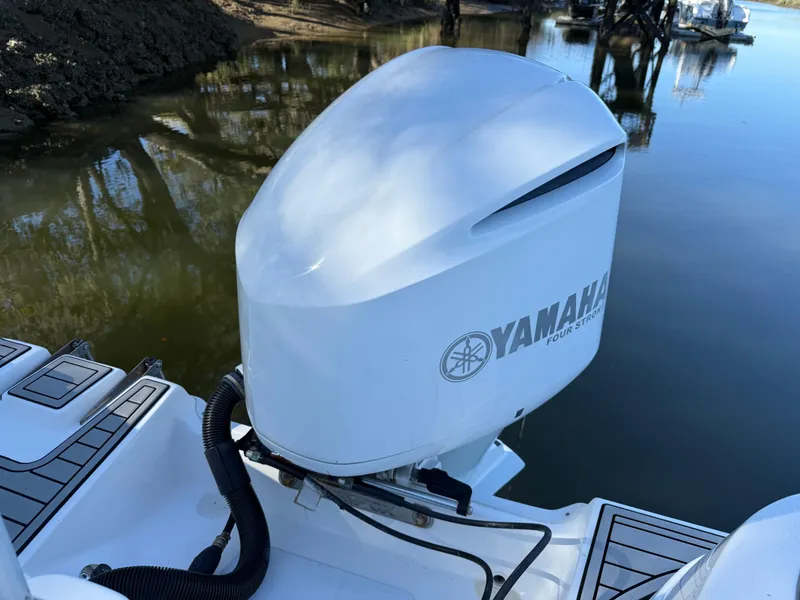 Slide: The Image of Yamaha outboard motor on 2020 Sea Fox 226 Traveler boat by a calm river. - 3