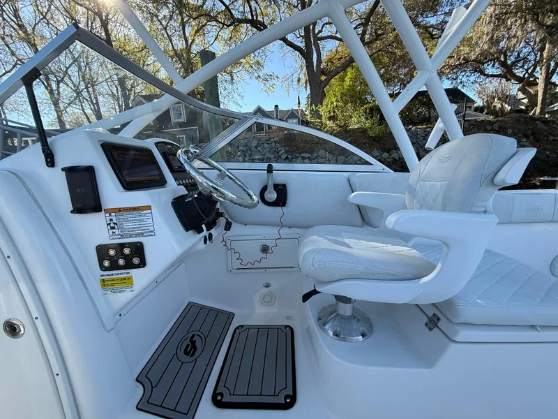 Slide: The Image of 2020 Sea Fox 226 Traveler boat interior with steering wheel and seating. - 6