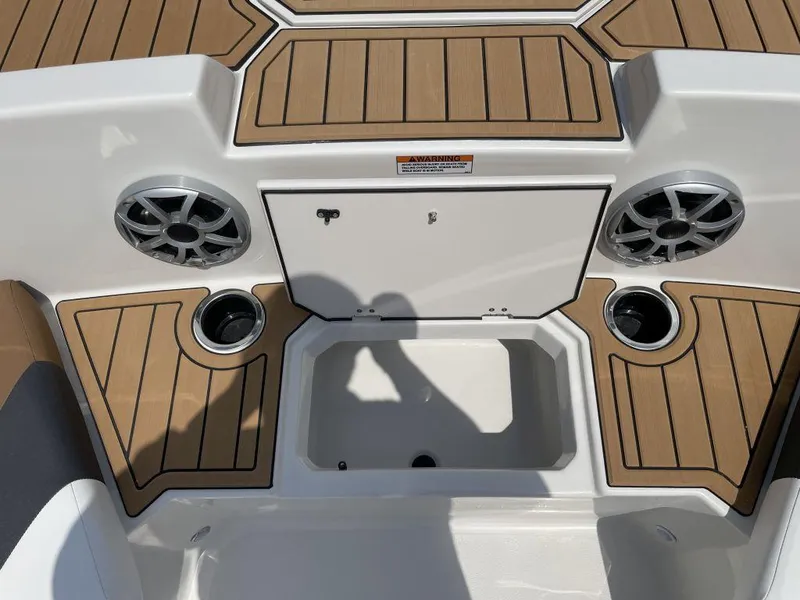 Slide: The Image of 2025 Starcraft SVX 171 OB boat deck with speakers and storage compartment. - 15