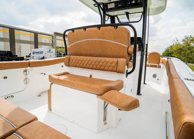 Slide: The Image of 2025 Sea Hunt Ultra 255 SE boat interior with tan leather seating and modern design. - 10