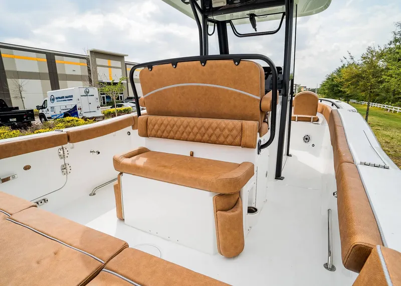 Slide: The Image of 2025 Sea Hunt Ultra 255 SE boat interior with tan seating and modern design. - 11