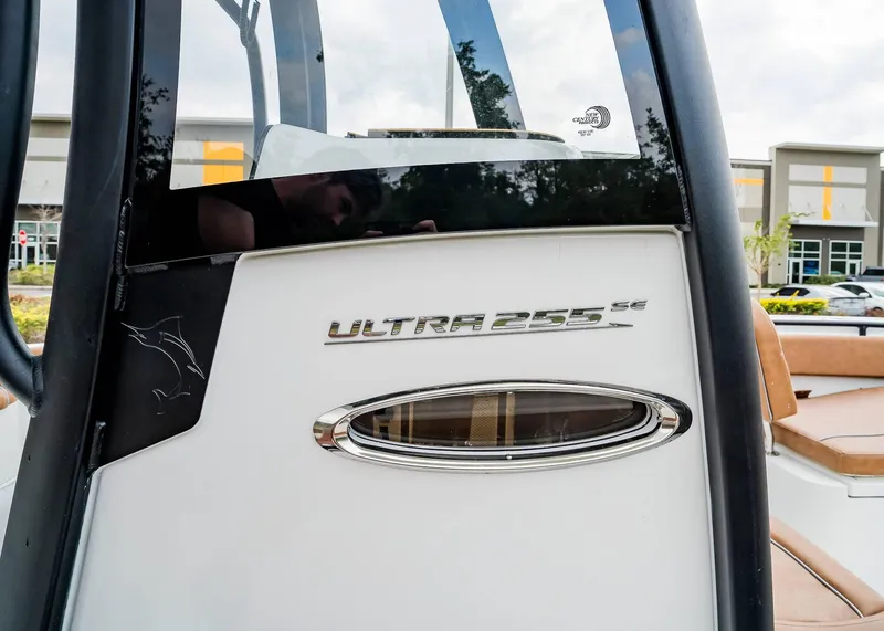 Slide: The Image of 2025 Sea Hunt Ultra 255 SE boat, close-up of model name and logo. - 14