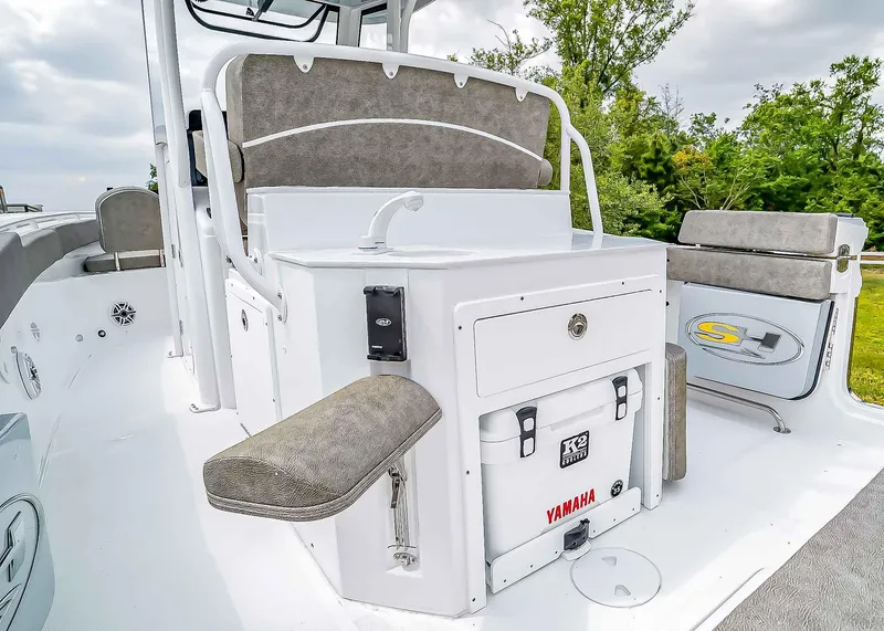 Slide: The Image of 2025 Sea Hunt Ultra 275 SE boat interior with seating and storage. - 14