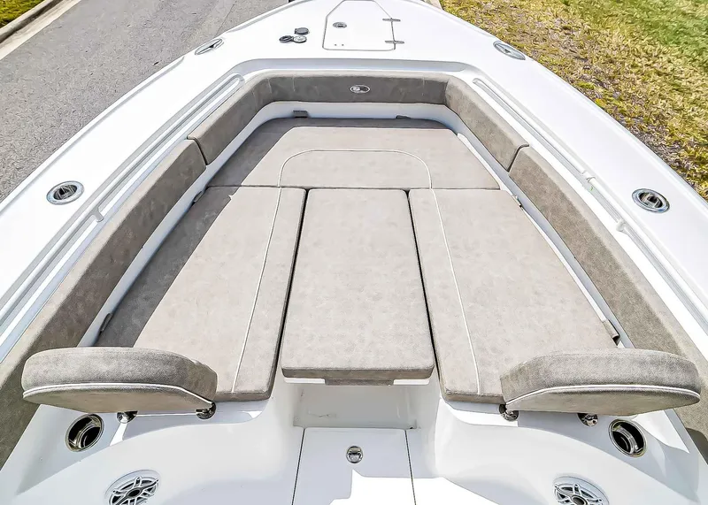 Slide: The Image of 2025 Sea Hunt Ultra 275 SE boat with spacious cushioned seating area. - 18