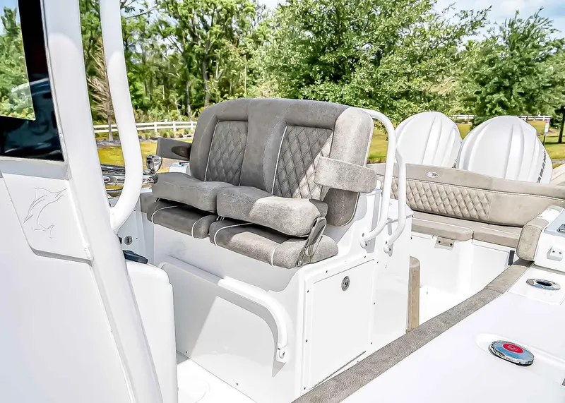Slide: The Image of 2025 Sea Hunt Ultra 275 SE boat interior with plush seating and modern design. - 21