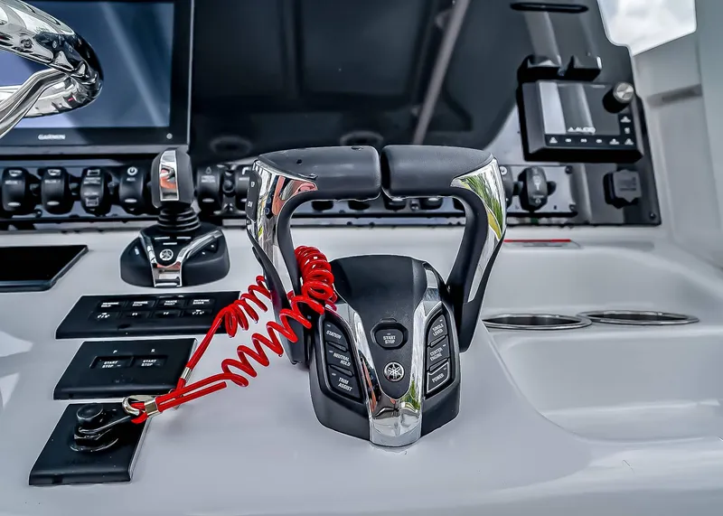Slide: The Image of Control panel of 2025 Sea Hunt Ultra 275 SE boat with advanced throttle system. - 23