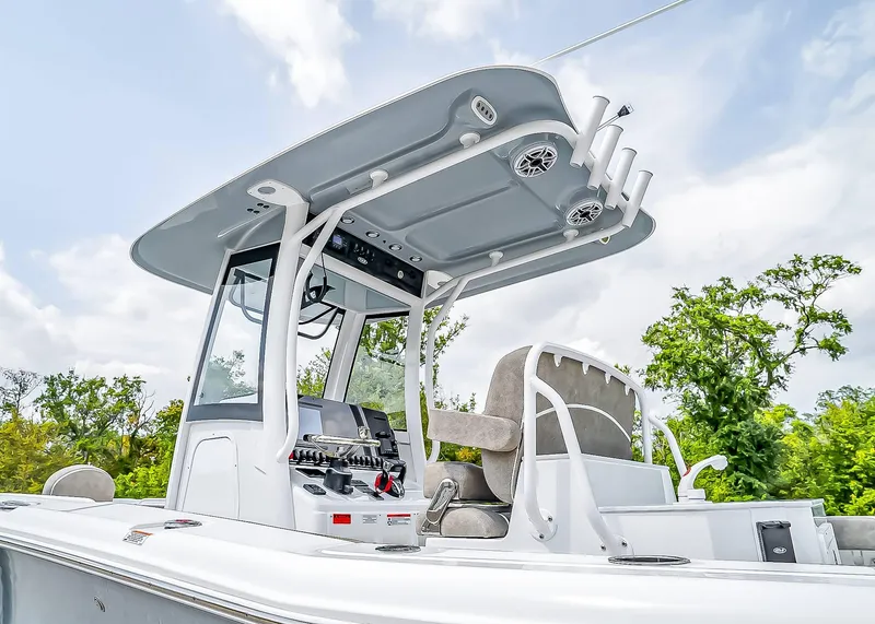 Slide: The Image of 2025 Sea Hunt Ultra 275 SE boat with modern console and seating, set against a cloudy sky. - 6