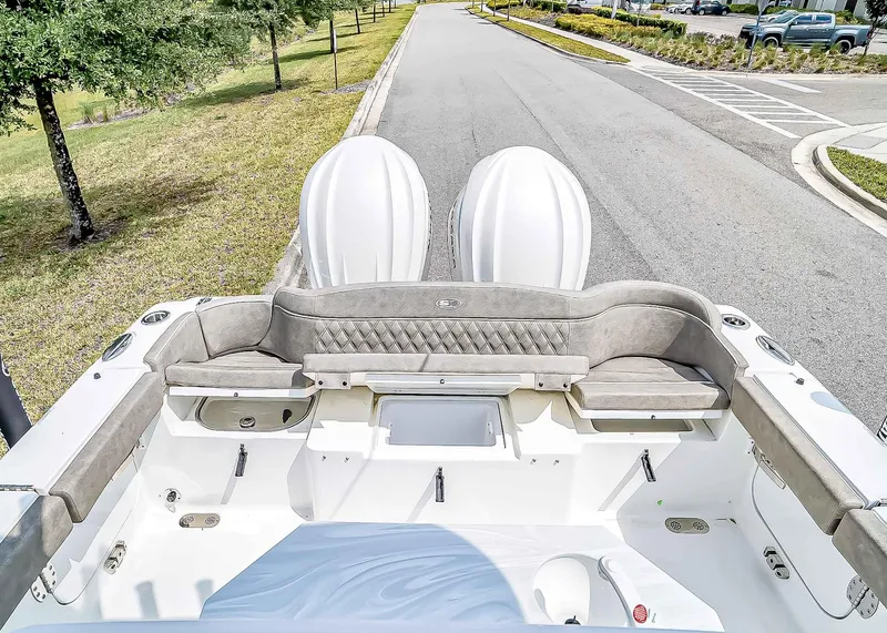 Slide: The Image of 2025 Sea Hunt Ultra 275 SE boat interior with seating and dual engines. - 8