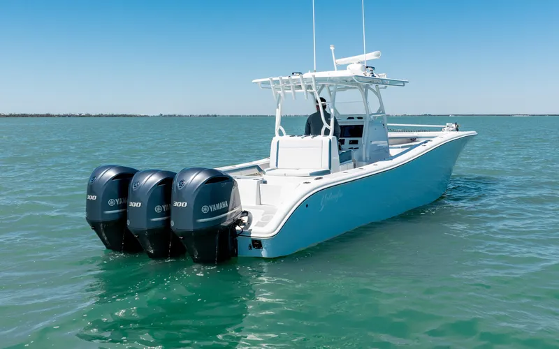 Slide: The Image of 2019 Yellowfin 36 boat with triple Yamaha engines on open water. - 13