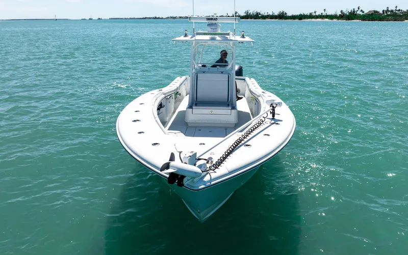 Slide: The Image of 2019 Yellowfin 36 boat on clear turquoise water, viewed from the front. - 14