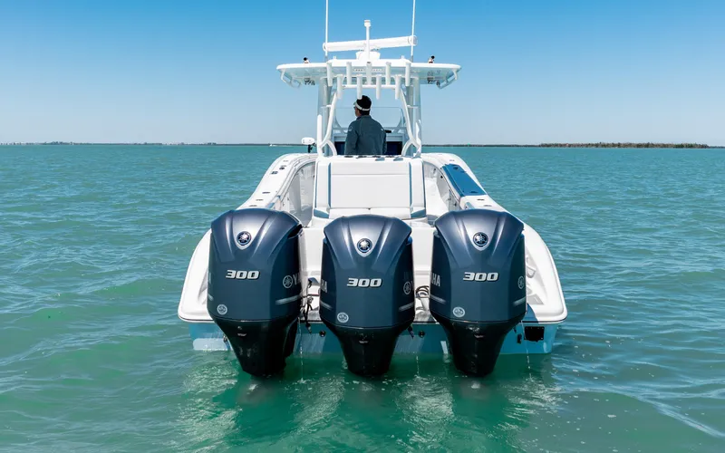 Slide: The Image of 2019 Yellowfin 36 boat with triple 300 horsepower engines on open water. - 16