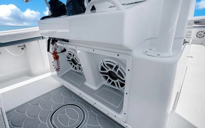 Slide: The Image of 2019 Yellowfin 36 boat interior with speakers and sleek white design. - 21