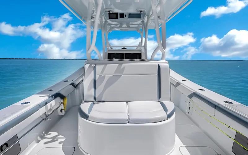 Slide: The Image of 2019 Yellowfin 36 boat interior with seating, ocean view, and blue sky. - 24