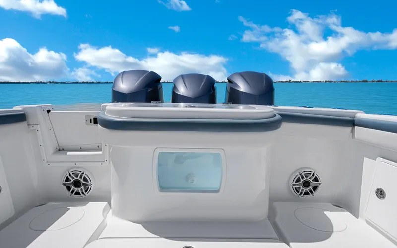 Slide: The Image of 2019 Yellowfin 36 boat with triple engines, ocean view, and clear blue sky. - 27