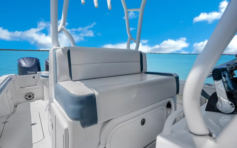 Slide: The Image of 2019 Yellowfin 36 boat interior with seating, ocean view, and clear blue sky. - 29