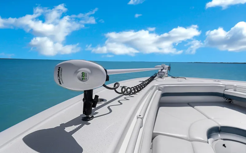 Slide: The Image of 2019 Yellowfin 36 boat with trolling motor on calm ocean under blue sky. - 34