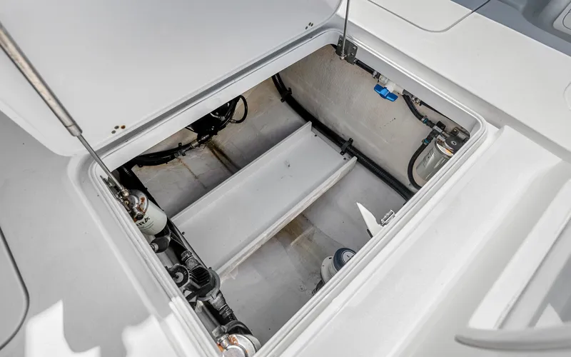 Slide: The Image of 2019 Yellowfin 36 boat storage compartment with visible wiring and components. - 39