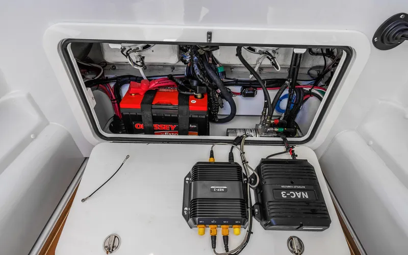 Slide: The Image of 2019 Yellowfin 36 boat electrical compartment with battery and wiring. - 41