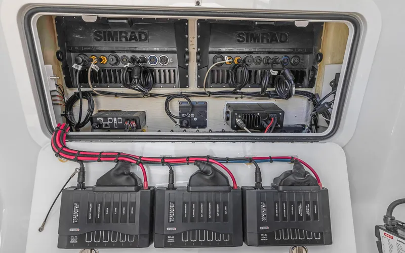 Slide: The Image of 2019 Yellowfin 36 boat electronics panel with Simrad systems and wiring. - 42