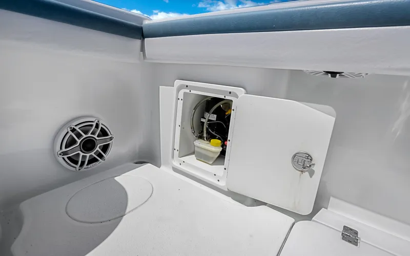 Slide: The Image of 2019 Yellowfin 36 boat interior with open storage compartment and speaker. - 43