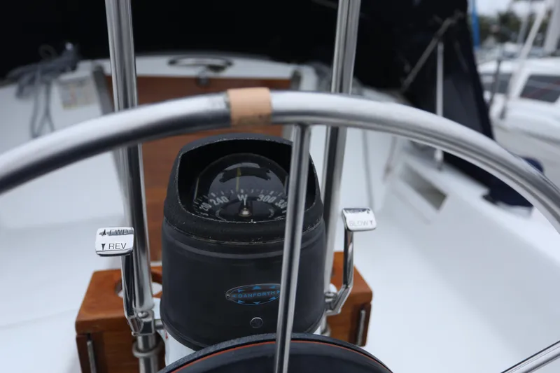 Slide: The Image of Steering wheel and compass of a 1995 Catalina 30 yacht. - 14