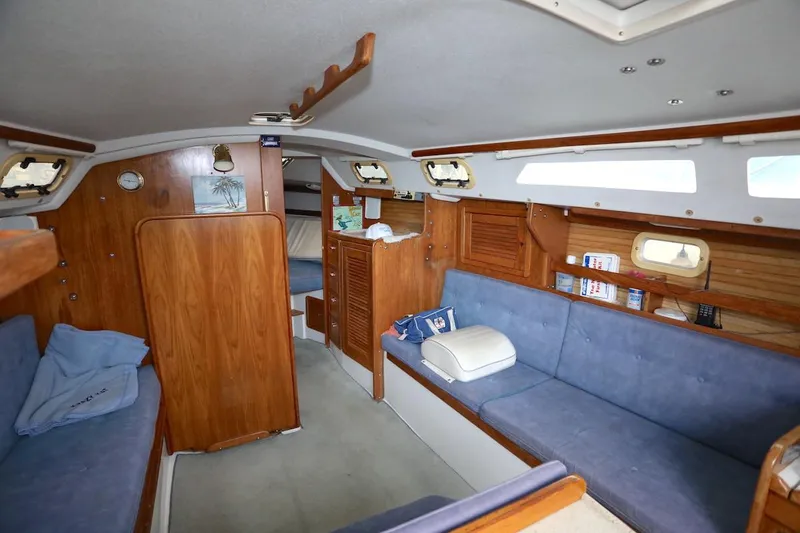 Slide: The Image of Interior of a 1995 Catalina 30 yacht with blue upholstery. - 16
