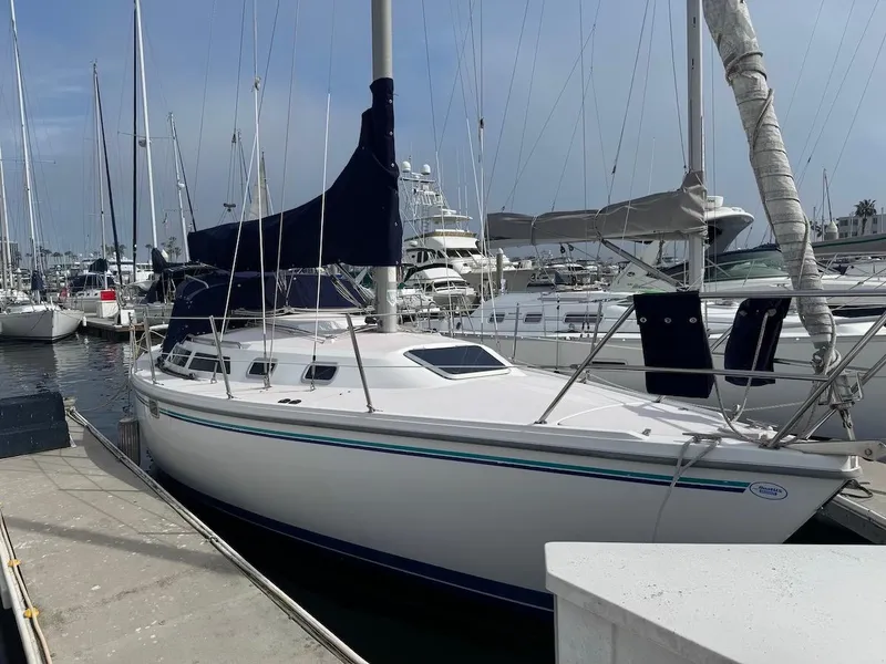 Slide: The Image of 1995 Catalina 30 sailboat docked in marina. - 2