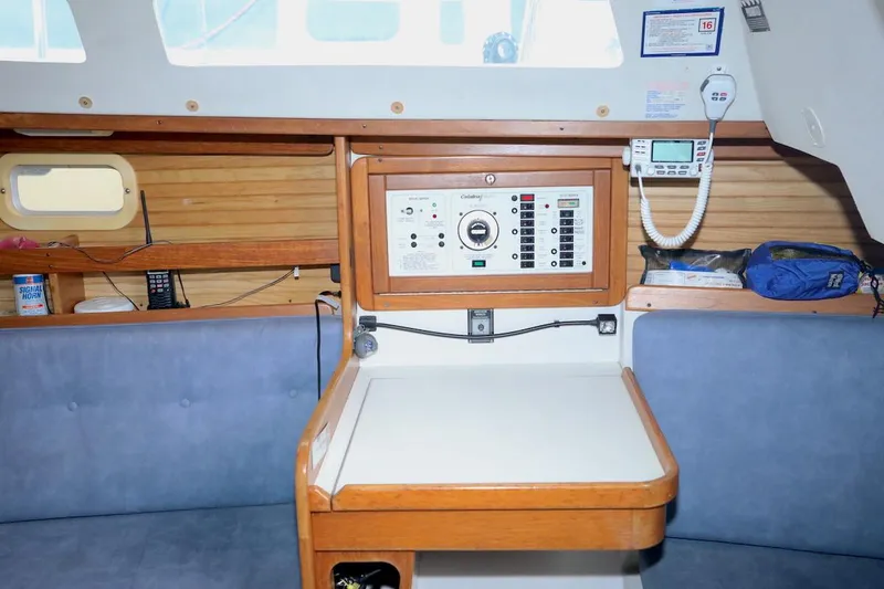 Slide: The Image of Interior of a 1995 Catalina 30 sailboat with navigation station. - 21