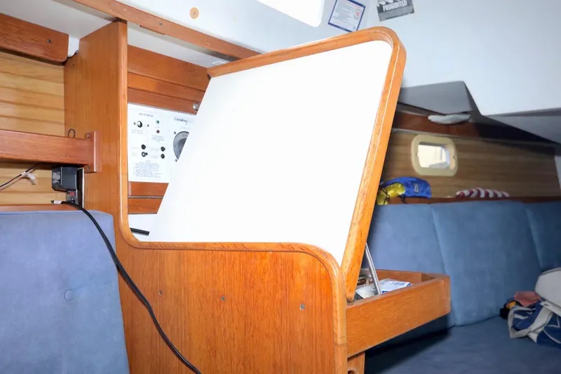 Slide: The Image of Interior of a 1995 Catalina 30 yacht with wooden furnishings. - 22