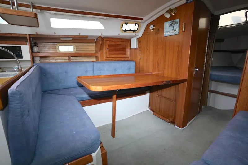 Slide: The Image of Interior of a 1995 Catalina 30 yacht with blue upholstery. - 26